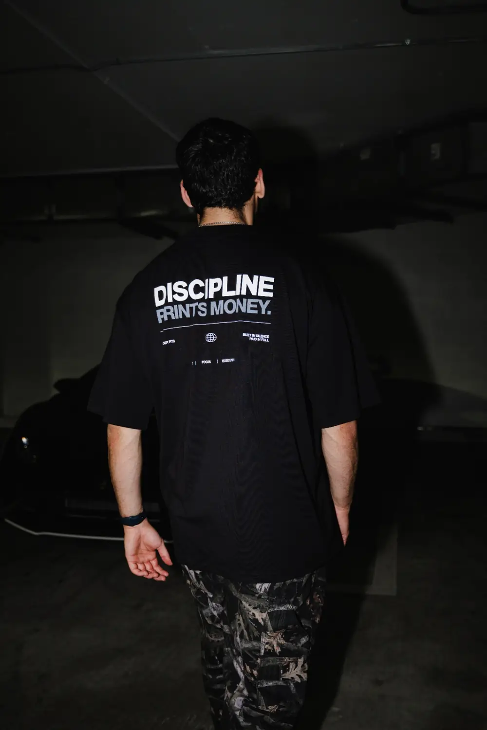 Group wearing Trader Fits tees and hoodies on location