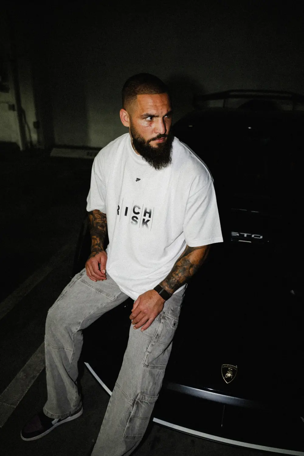 Group wearing Trader Fits tees and hoodies on location