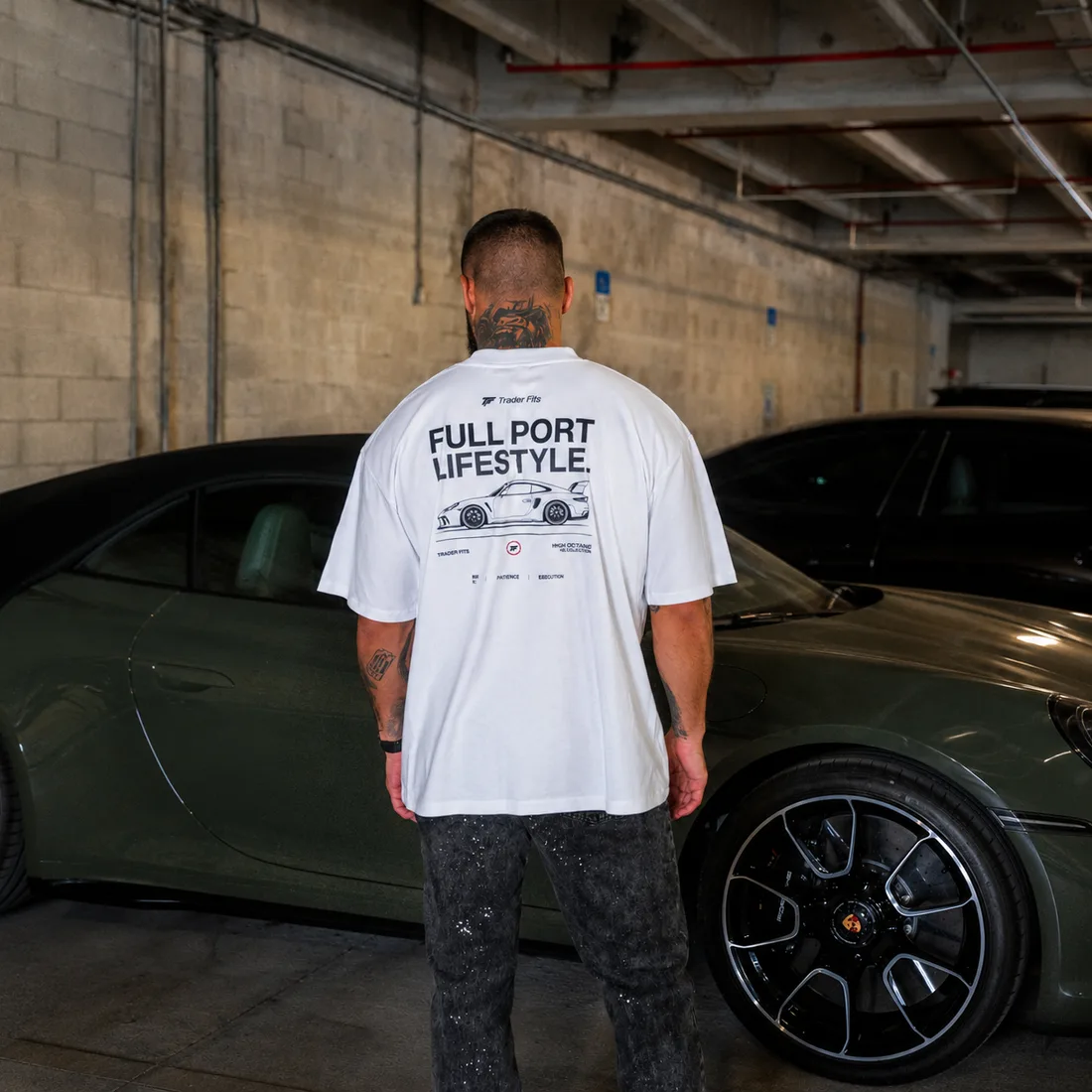 Full Port Lifestyle tee worn beside a Porsche